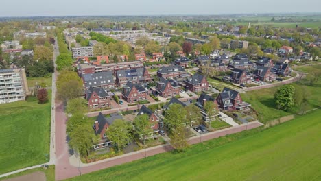 beautiful aerial of stunning modern suburban neighborhood with photovoltaic solar panels on rooftops