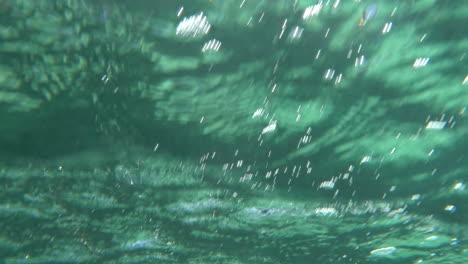 Water-scene-with-ripples-and-sun-reflection