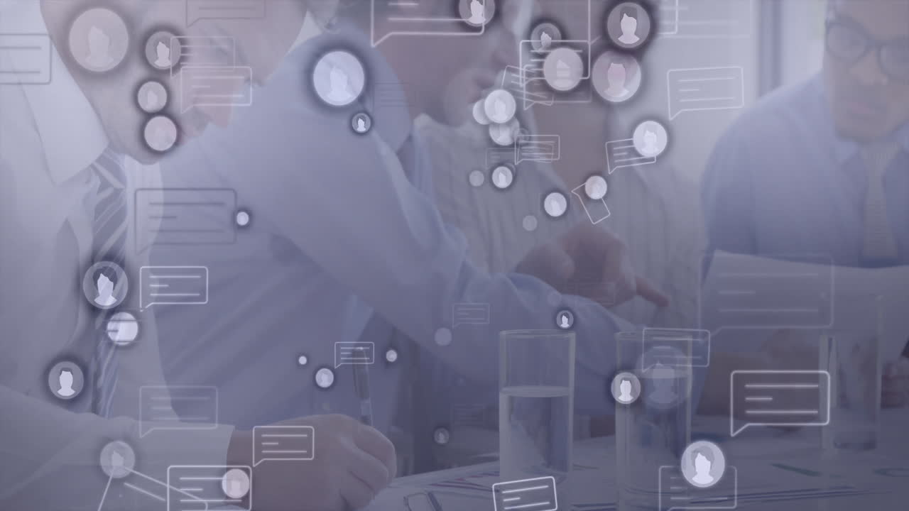 In school, animation of social media icons overlaying business meeting discussion