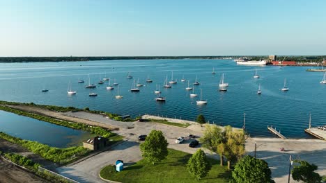 flyover of sailboats in a small harbor