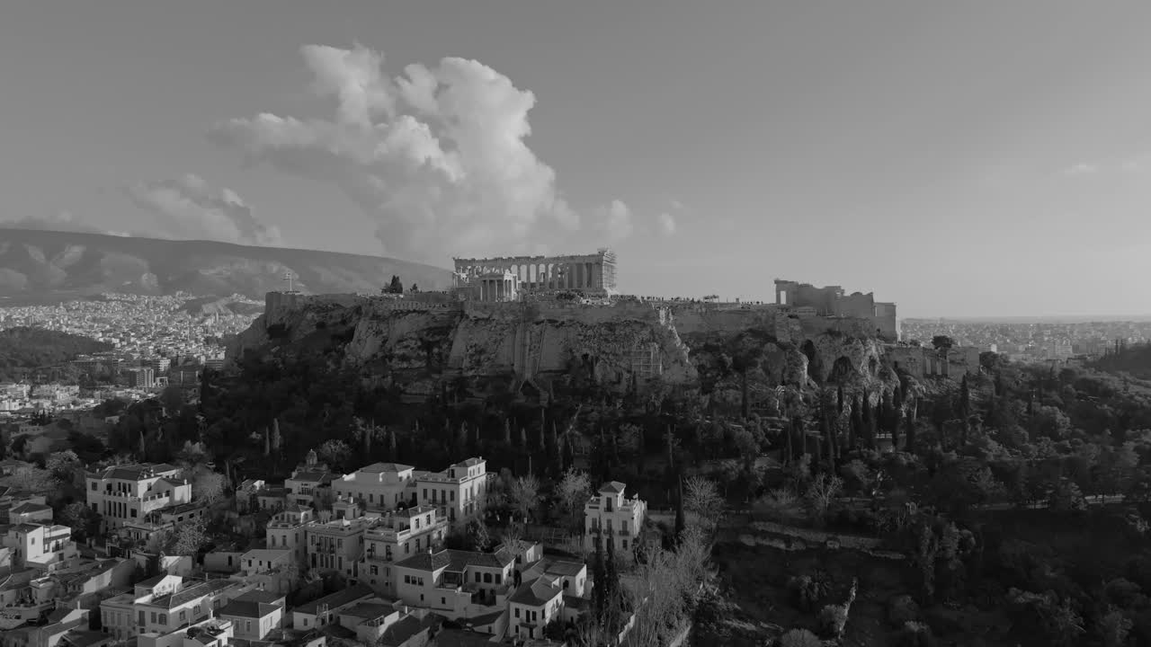 Experience the Acropolis of Athens in a new light with this captivating black and white drone video. The absence of color creates a dramatic and timeless atmosphere.
