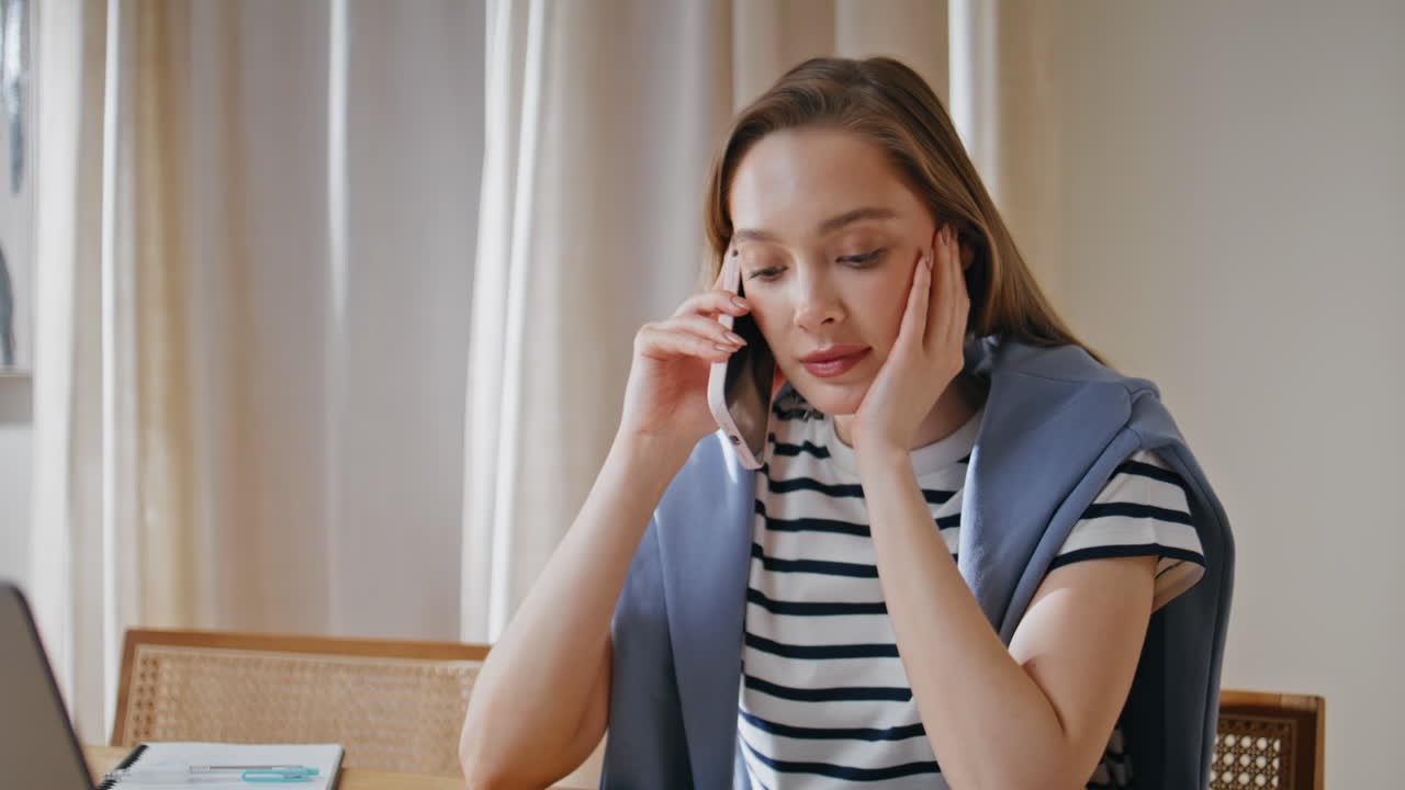 Attractive student talking smartphone sitting home closeup. Woman speaking
