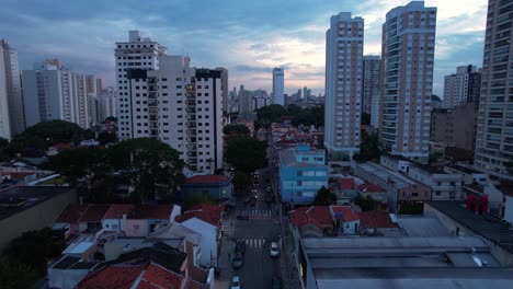 flying through a quiet cityscape, blue hour in sao paulo, brazil - aerial view