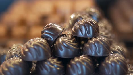 a pile of dark chocolate candies