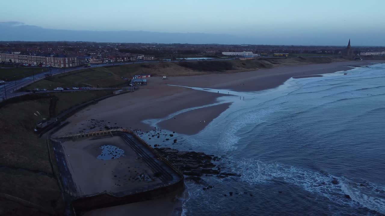 Drone retreating from Tynemouth Longsands beach on quiet spring morning