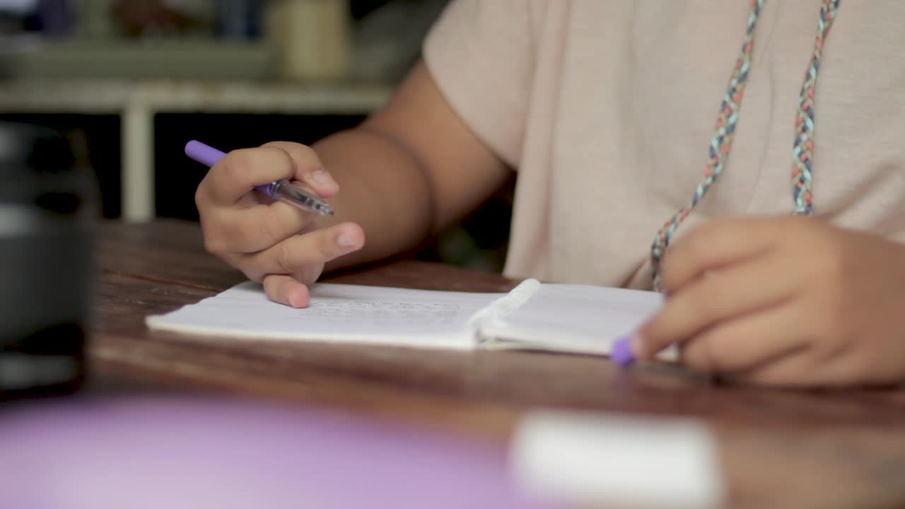 Girl Hands Writing on Paper with Pen, Writing on a Wooden Table