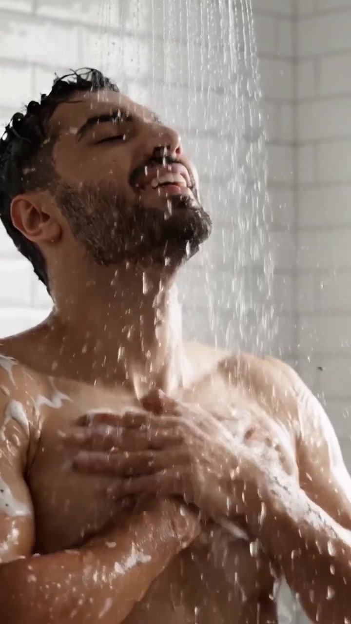 A Refreshing Shower Experience: Enjoying the Invigorating Sensation of Water and Soap in a Relaxing Bathroom Setting, Highlighting Personal Care and Hygiene Routines
