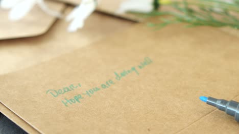 close up of a handwritten card on brown paper