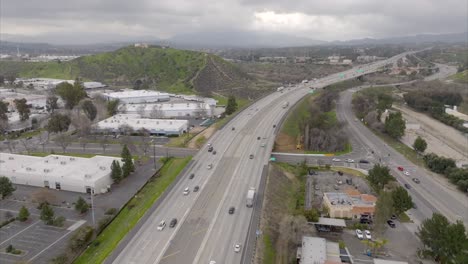 interstate 5 by santa clarita, california on an overcast day - aerial flyover