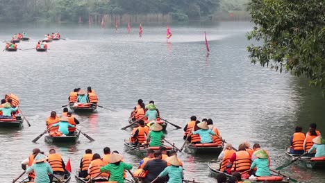 groups of people rowing boats on a river