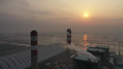 aerial view of a power plant at sunrise