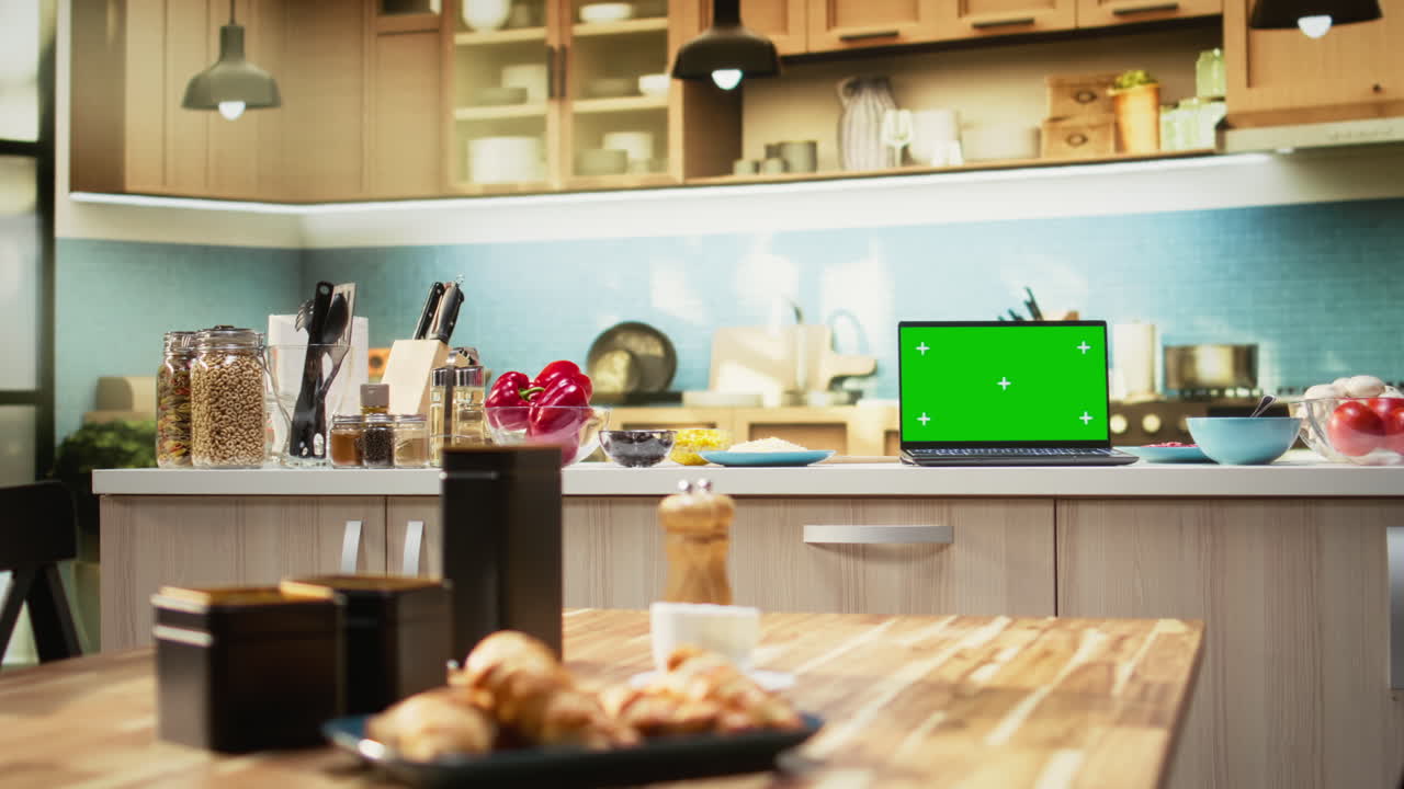 Isolated screen on laptop in modern kitchen used for cooking homemade pizza