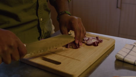 person cutting onion