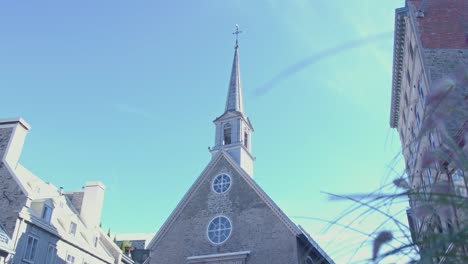 wide tilt down of the notre dame des victoires church in quebec city