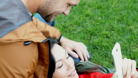 Couple-using-mobile-phone-while-interacting-with-each-other-4k