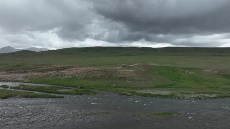 -Overcast-skies-over-Deosai-Skardu-river,-Pakistan---Aerial