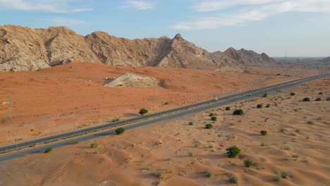 Aerial-view-of-UAE's-Al-Faya-mountain-range-landscape,-Sharjah's-Mleiha-Desert,-Al-Faya-desert-road,-United-Arab-Emirates