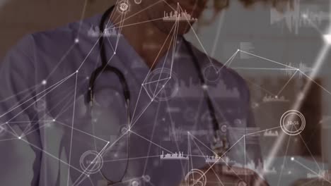 Animation-of-network-of-connections-over-caucasian-male-doctor-using-tablet