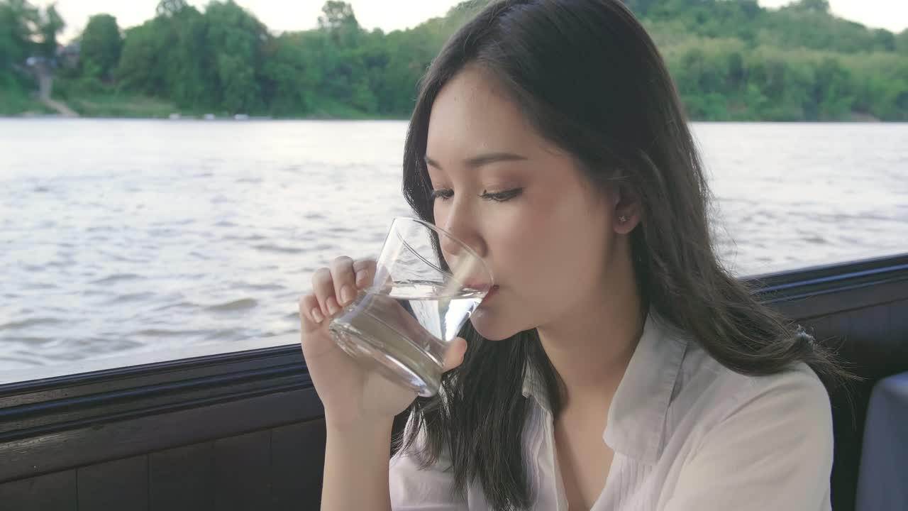 Asian Girl Drinking Water And Enjoy The View, Video In 4K