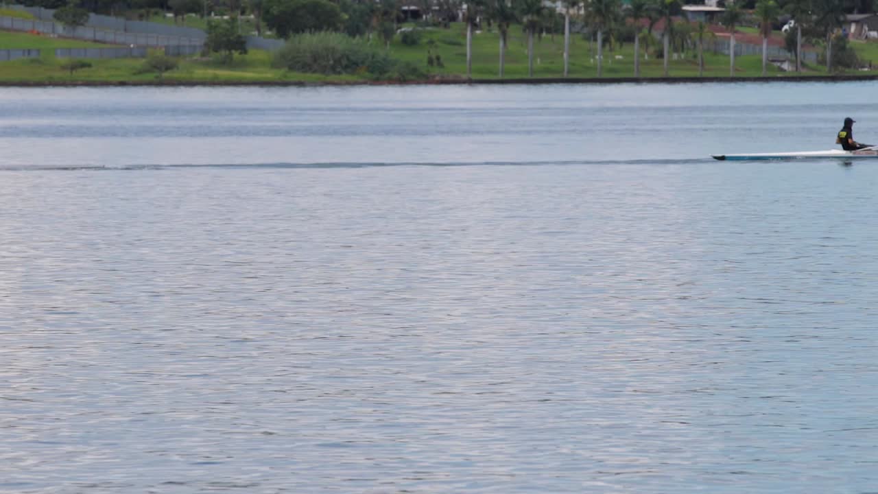 A rowing team sails on the lake.