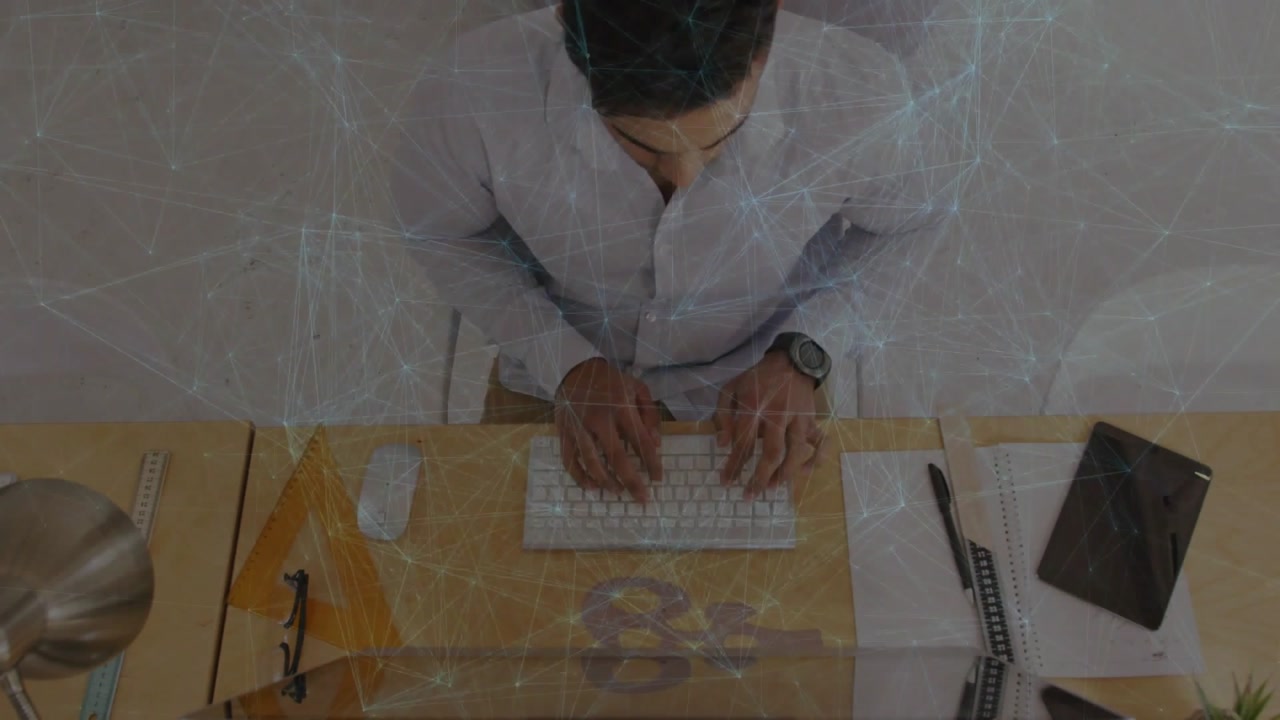 Man typing and clicking mouse at desk, keypress initiating web overlay mapping data for tech work