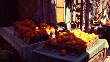 a street market stall selling fresh oranges