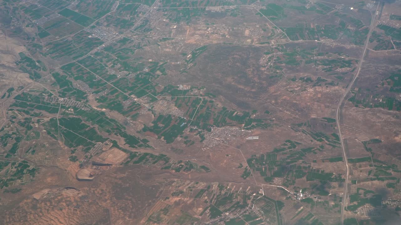 Plane flight aerial high above Austria, Europe near Salzburg with pre alps country side