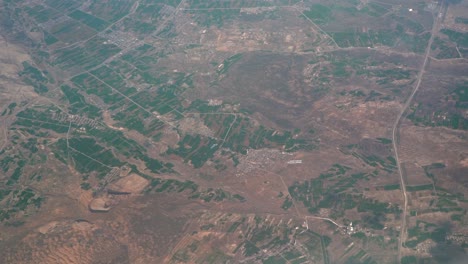 plane flight aerial high above austria, europe near salzburg with pre alps country side