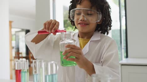 animación de formas sobre un escolar afroamericano en la clase de ciencias.