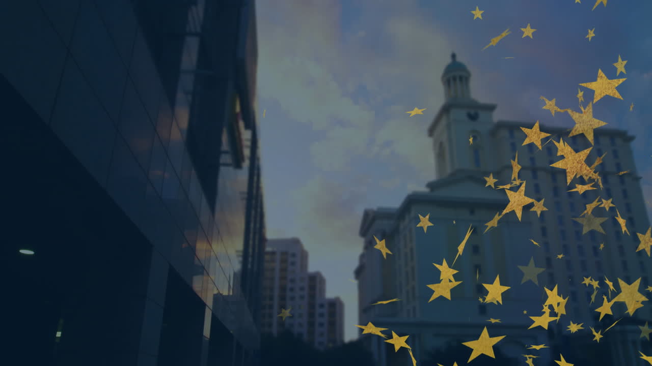 Golden stars animation floating over cityscape with tall buildings at dusk
