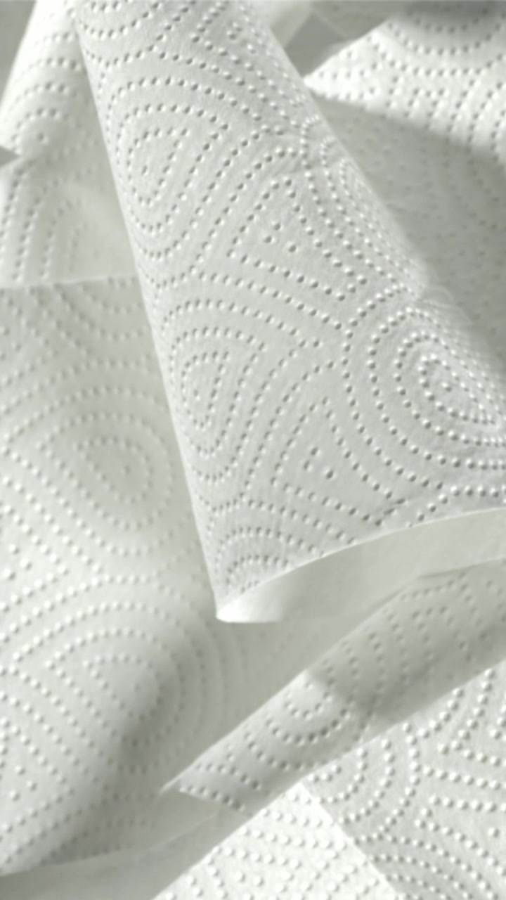 Close-up of White Paper Towel Rolls with Textured Pattern