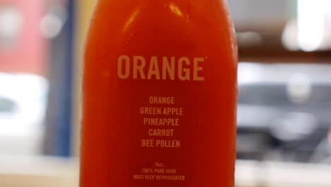 orange carrot and apple juice from detox cleanse recipe, close up shot