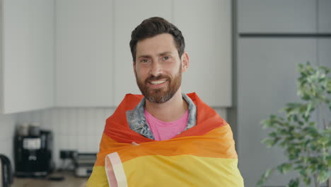 man draped in pride flag