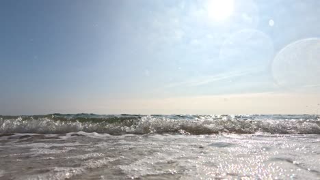 ocean waves gently crashing on sandy beach