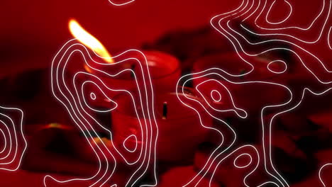 composición digital del patrón de topografía contra velas encendidas contra un fondo rojo