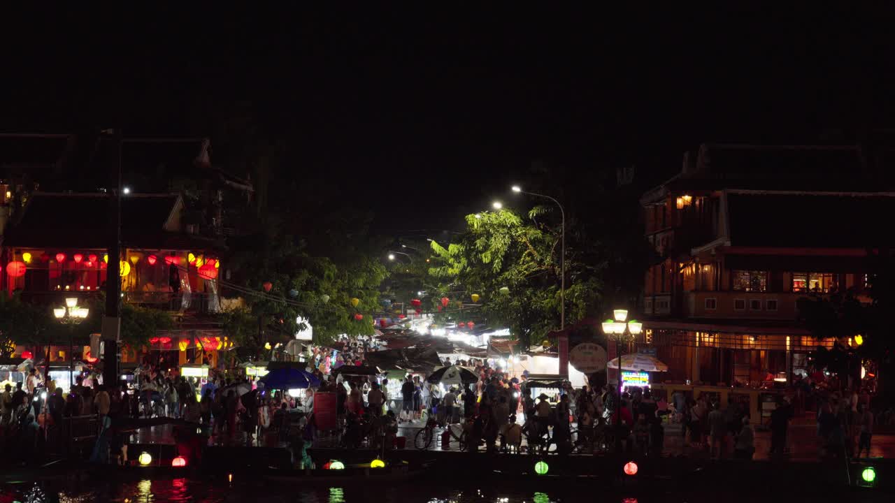 Waterfront city location, people evening scenery, colourful lanterns