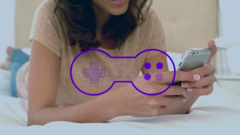 Animation-Des-Gamepad-Symbols-über-Einer-Biracial-Frau,-Die-Ihr-Smartphone-Nutzt