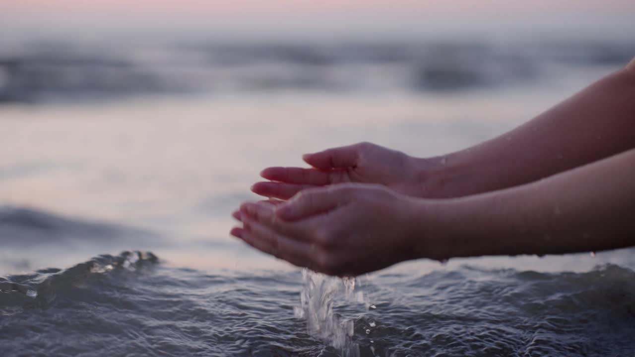Collecting Water with Hands in the Sea