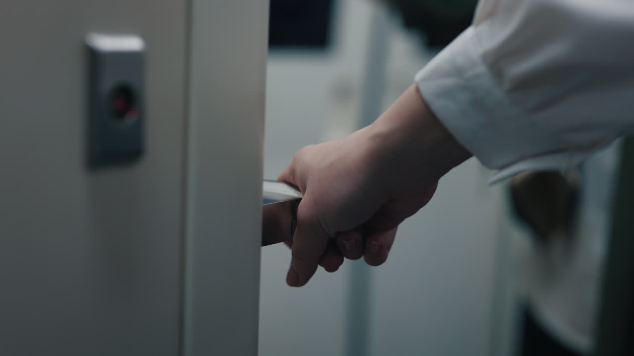 Person Opening an Elevator Door