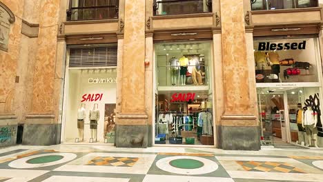 storefronts and shoppers in a bustling naples mall