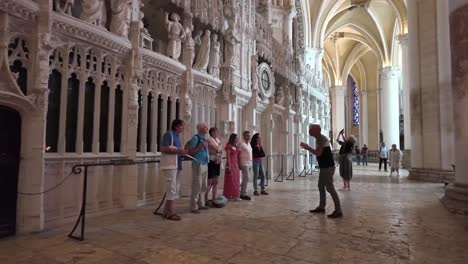 inside a historic cathedral with intricate architecture and visitors