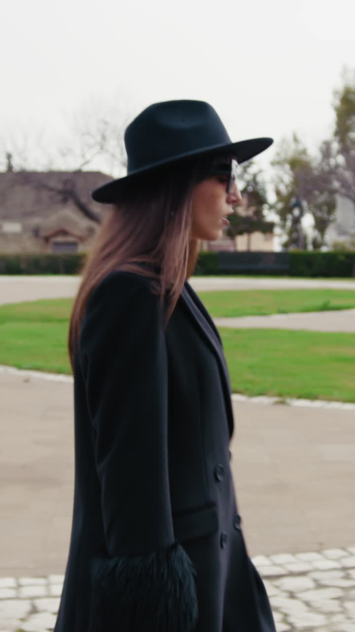 Elegant Woman Arriving At The Small Town Park During The Day