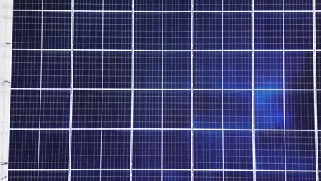 extreme close-up of crystalline photovoltaic cells forms blue geometric grid, ideal tech background for renewable themes. drone top view. drone aerial lombardy, italy lombardia, italia