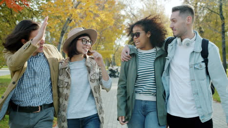 friends enjoying a fall day in the park