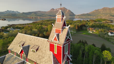 Cinematic-Flights-over-Buksnes-Church,-Norway-at-Sunset