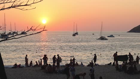 people enjoying a beach sunset together