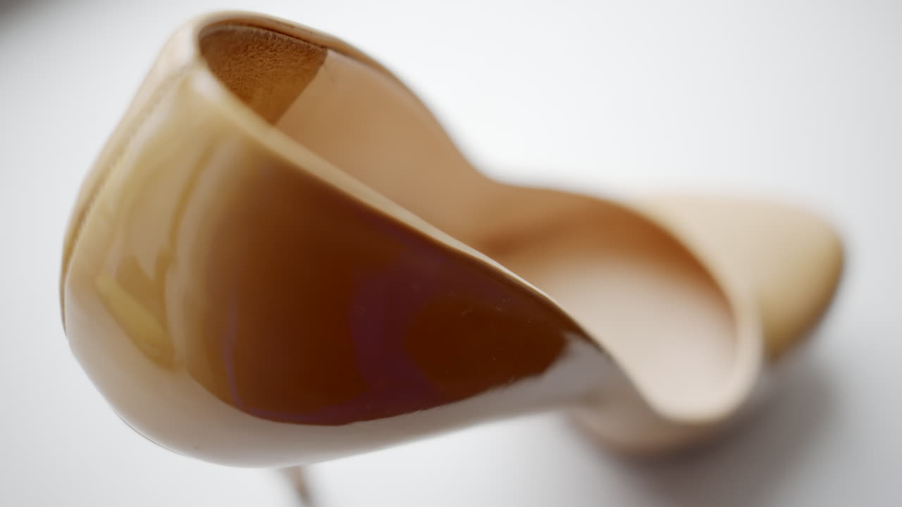 Beige woman high heels shoes close up composition