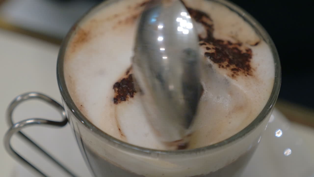Taking tasty foam from coffee
