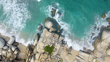 Waves-crashing-against-rocks-of-Tayrona-National-Park,-Colombia