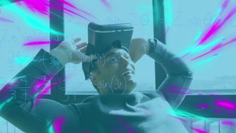 Animation-of-mathematical-formulas-over-businessman-using-vr-headset